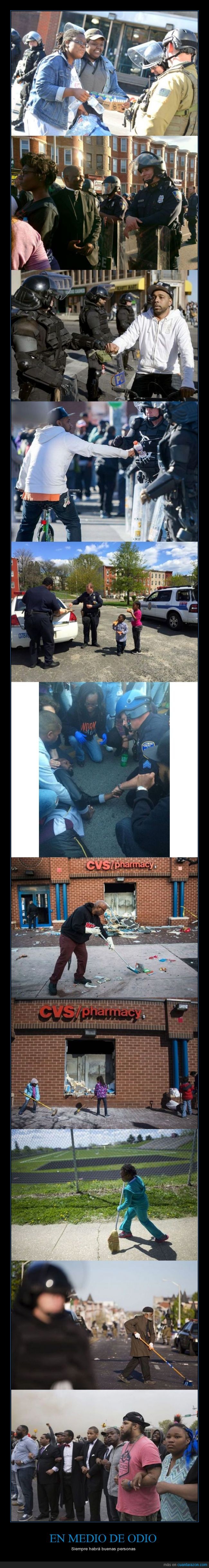 agua,amable,ayuda,ayudar,Baltimore,ciudadano,limpiar,llevar,manifestacion,niño,policia,racismo