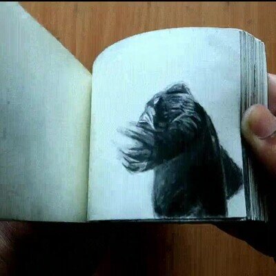 Enlace a Animación de Godzilla vs Kong en una libreta