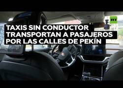 Enlace a Taxis sin conductor transportan pasajeros en Pekín