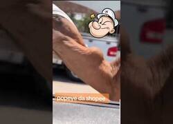 Enlace a Popeye sacando sus bíceps