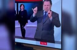 Enlace a La tremenda manera de un traductor de lengua de signos de representar una 'rave' en televisión