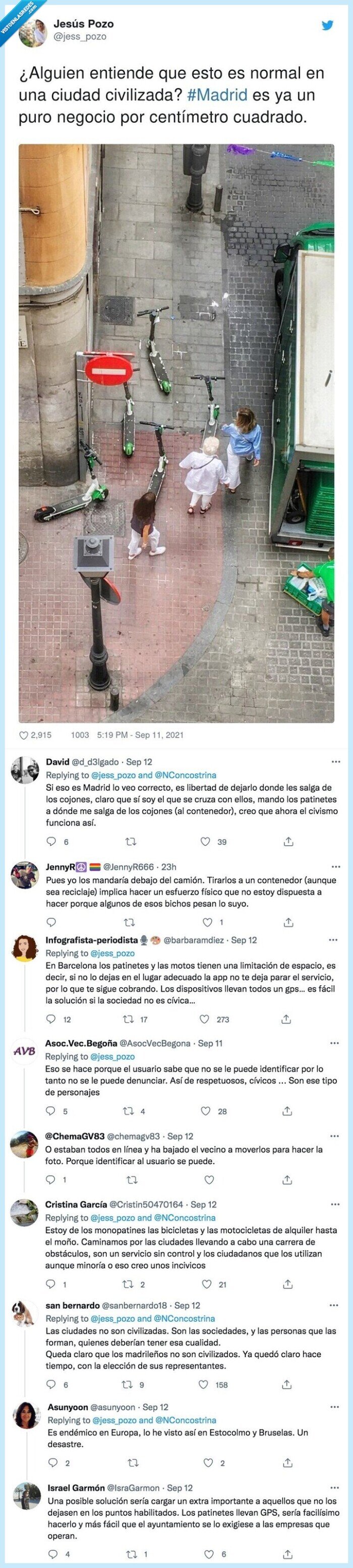 patinetes,madrid,foto,en medio,acera